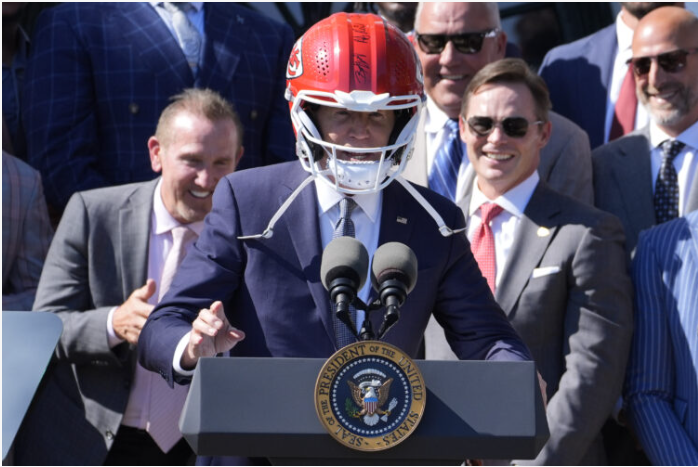 AFC WEST LATEST: US President Hosts Back-To-Back Super Bowl Champions At The White House. Breaks Unofficial Political Rule About Headwear As He Dons A Kansas City Helmet. Many Anticipated Seeing Taylor Swift, The Girlfriend Of Tight End Travis Kelce.