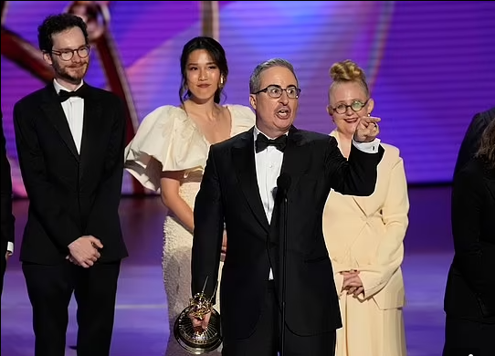 John Oliver Makes Most Memorable At The ‘Emmys, As His Pays Tribute To Late Pet. Rips Musical Producer For Disruption…SEE MORE…